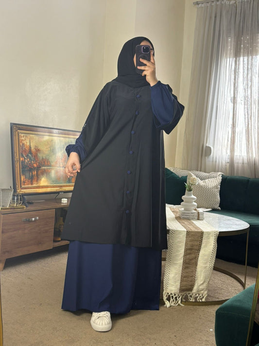 عباية محتشمة بلمسة عصرية، قطعة من قطعتين بلونين متناسقين تمنحك إطلالة أنيقة ومريحة في كل الأوقات.